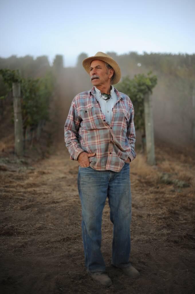 David Hirsch standing in a vineyard. Photo by Erik Castro for The New California Wine, Ten Speed Press.