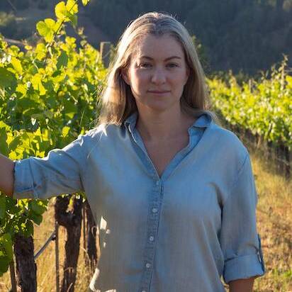 Jasmine Hirsch standing in vineyard