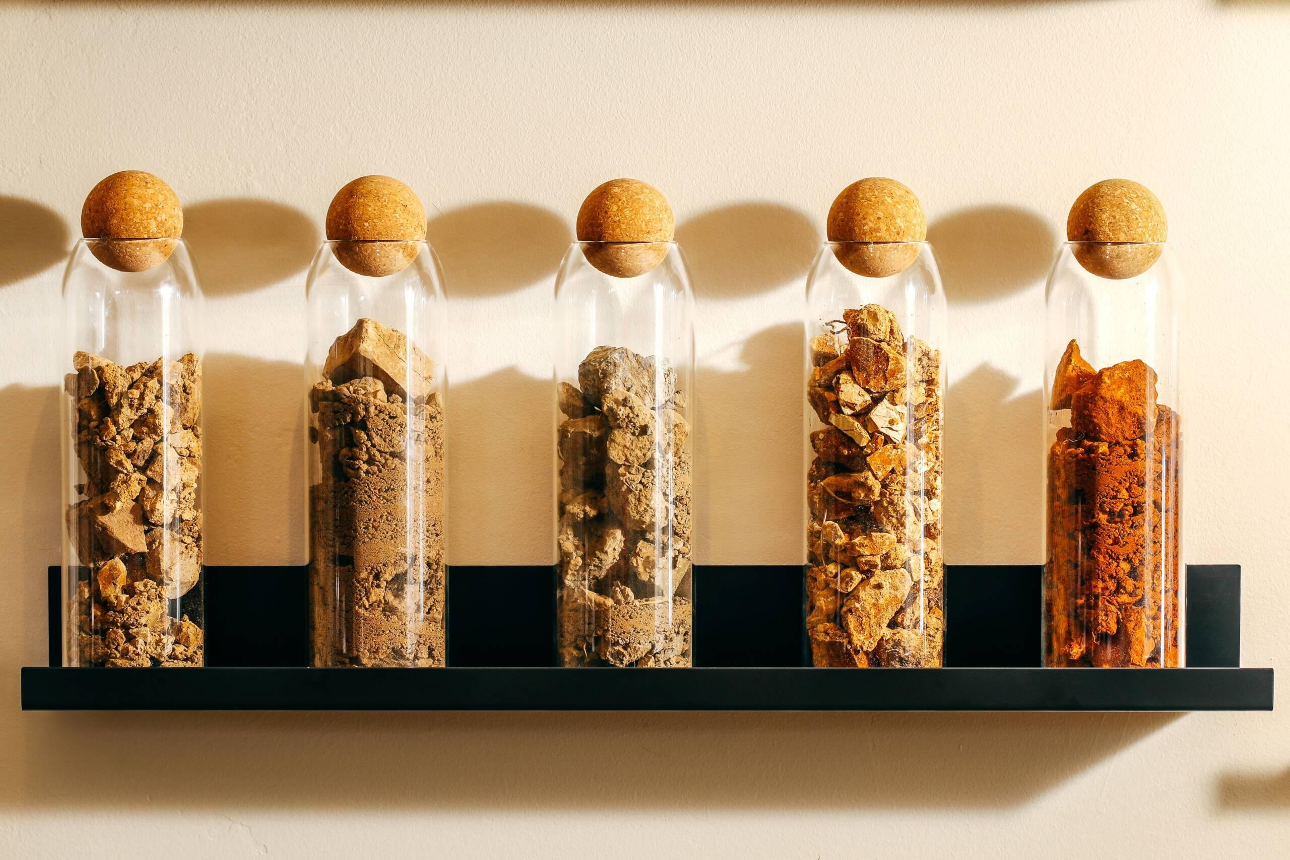 Jars of soil samples taken from Hirsch Vineyards showing the range of soil types from the estate.